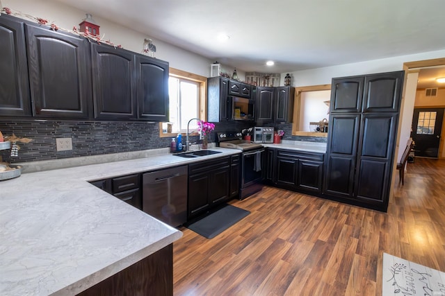 9143 S 900 W, Lafontaine, IN 46940 - kitchen with stainless steel appliances, a sink, decorative backsplash, light countertops, and dark wood finished floors