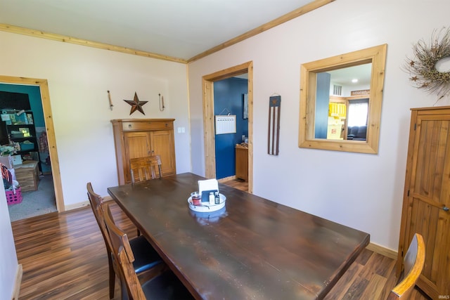 9143 S 900 W, Lafontaine, IN 46940 - dining room featuring dark wood-type flooring, crown molding, and baseboards