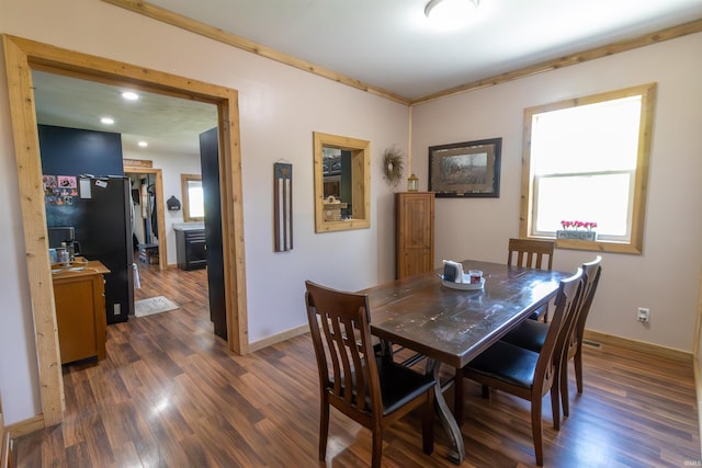 9143 S 900 W, Lafontaine, IN 46940 - dining space with dark wood-style floors, baseboards, crown molding, and recessed lighting