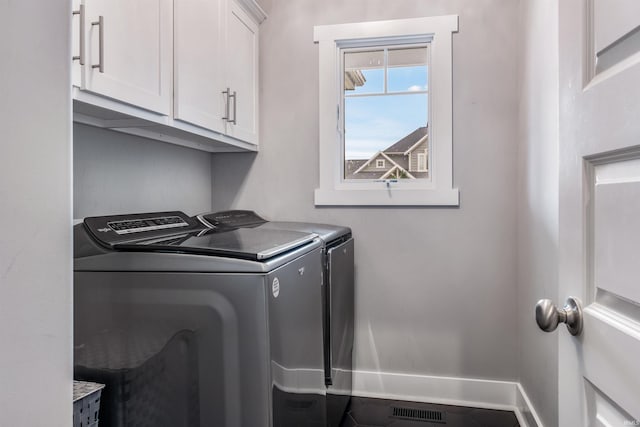 13606 Paperbark Trl, Fort Wayne, IN 46814 - washroom featuring washer and clothes dryer, cabinet space, and baseboards