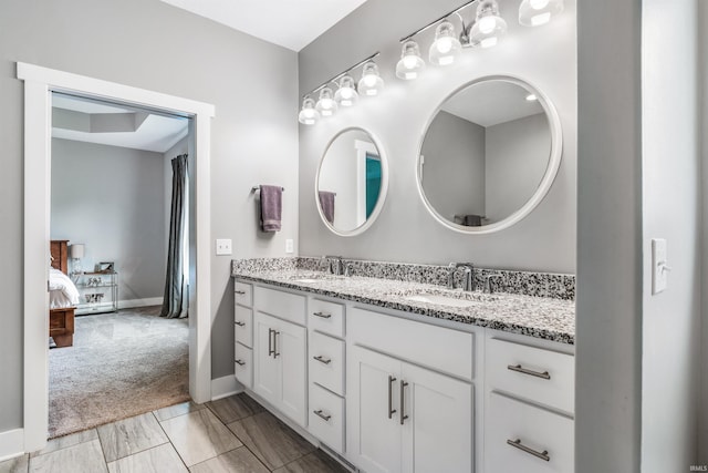 13606 Paperbark Trl, Fort Wayne, IN 46814 - full bath featuring double vanity, connected bathroom, and baseboards