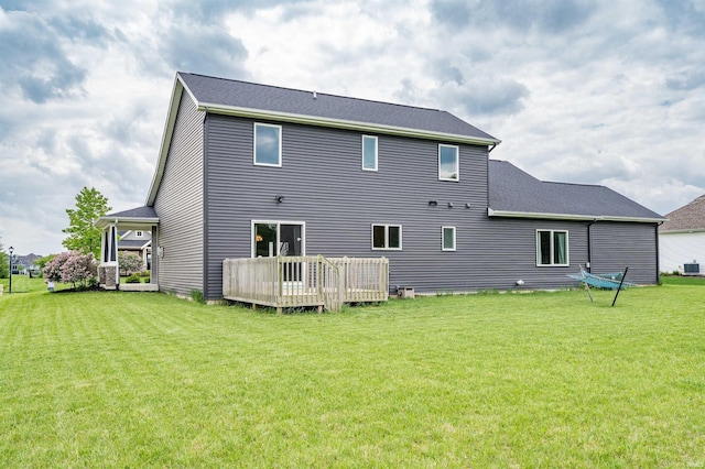 13606 Paperbark Trl, Fort Wayne, IN 46814 - back of house featuring a wooden deck, a lawn, and central AC