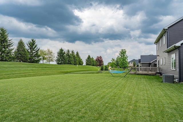 13606 Paperbark Trl, Fort Wayne, IN 46814 - view of green lawn with central AC unit and a deck