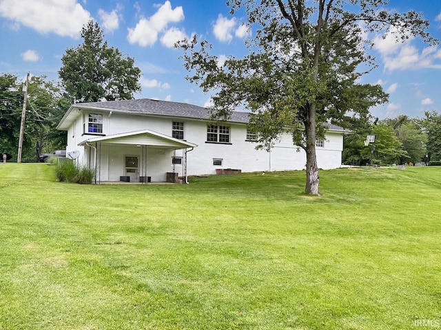 1238 W Wortman Rd, Evansville, IN 47725 - rear view of property with a yard and a patio