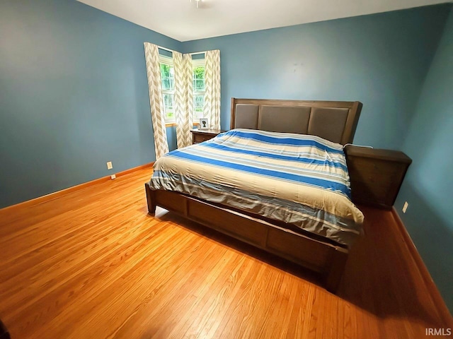 1238 W Wortman Rd, Evansville, IN 47725 - bedroom with wood finished floors and baseboards