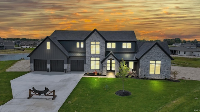 17807 Milazzo Cv, Huntertown, IN 46748 - view of front facade featuring stone siding, board and batten siding, a front lawn, driveway, and a shingled roof