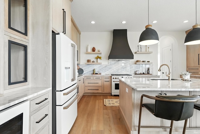 17807 Milazzo Cv, Huntertown, IN 46748 - kitchen featuring white refrigerator with ice dispenser, custom range hood, open shelves, wine cooler, and gas range