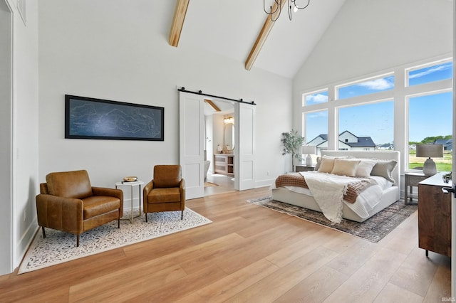 17807 Milazzo Cv, Huntertown, IN 46748 - bedroom with a barn door, high vaulted ceiling, light wood-style floors, baseboards, and beamed ceiling