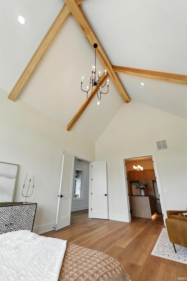 17807 Milazzo Cv, Huntertown, IN 46748 - bedroom featuring a chandelier, beam ceiling, high vaulted ceiling, wood finished floors, and recessed lighting