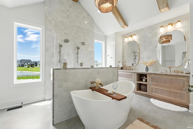 17807 Milazzo Cv, Huntertown, IN 46748 - bathroom with tile walls, a walk in shower, a freestanding bath, double vanity, and tile patterned flooring