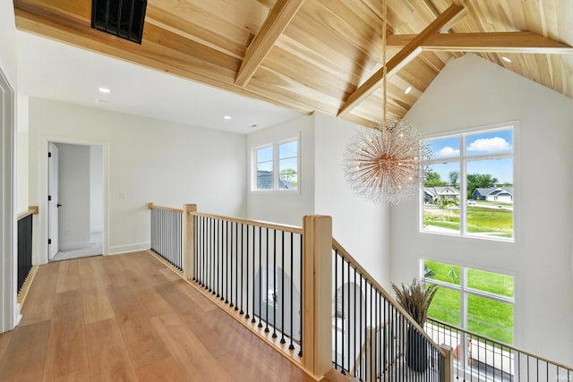 17807 Milazzo Cv, Huntertown, IN 46748 - corridor with an upstairs landing, wood finished floors, high vaulted ceiling, a chandelier, and wooden ceiling with exposed beams