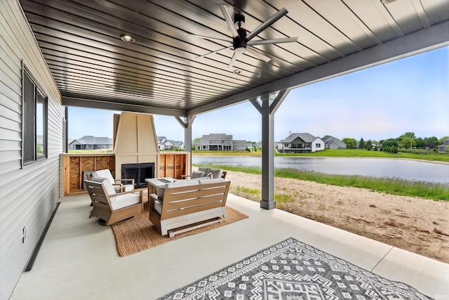 17807 Milazzo Cv, Huntertown, IN 46748 - view of patio with an outdoor living space with a fireplace, a water view, and a ceiling fan