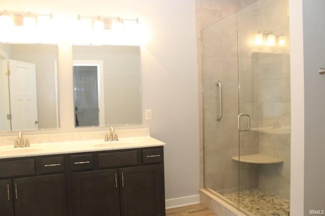 5110 Mustang Dr, Evansville, IN 47715 - full bath with double vanity, a shower stall, and baseboards