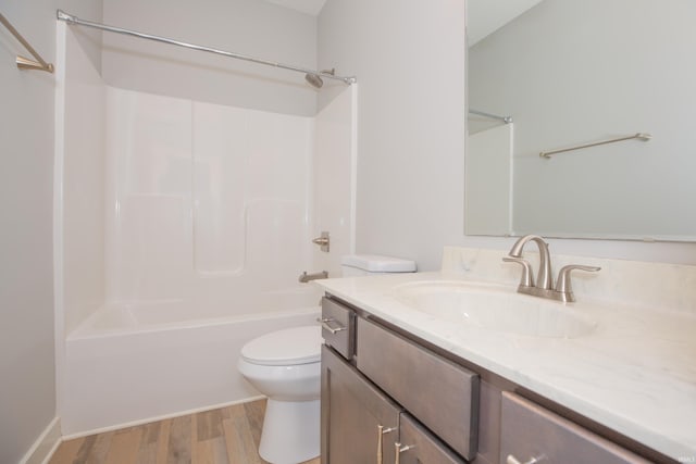 5110 Mustang Dr, Evansville, IN 47715 - full bathroom with toilet, wood finished floors, vanity, and washtub / shower combination