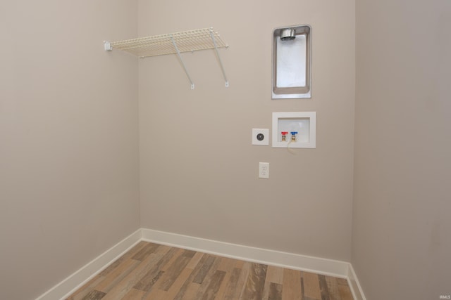 5110 Mustang Dr, Evansville, IN 47715 - laundry area with electric dryer hookup, baseboards, light wood-type flooring, and hookup for a washing machine