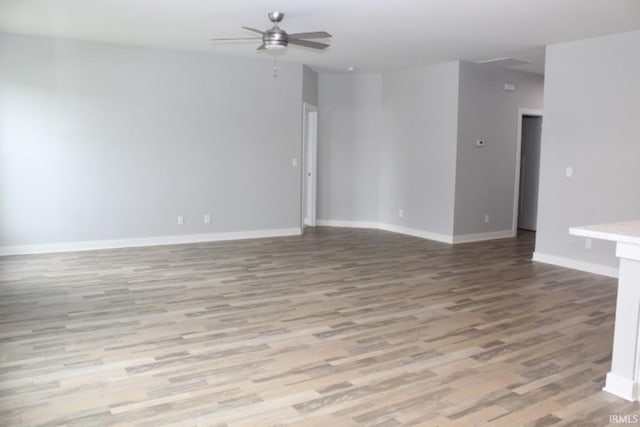 5110 Mustang Dr, Evansville, IN 47715 - unfurnished room featuring wood finished floors, a ceiling fan, and baseboards