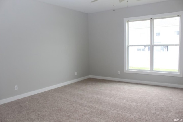 5110 Mustang Dr, Evansville, IN 47715 - spare room featuring light carpet, plenty of natural light, ceiling fan, and baseboards