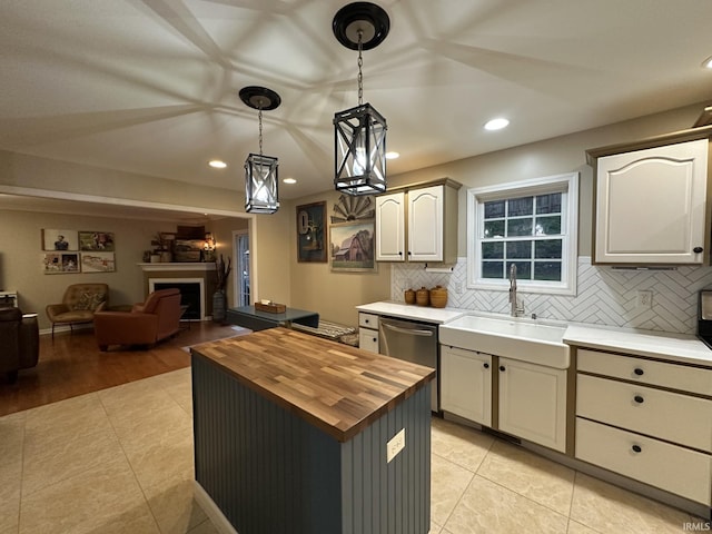 212 Alexandria Dr, Newburgh, IN 47630 - kitchen featuring butcher block countertops, dishwasher, decorative backsplash, a sink, and recessed lighting