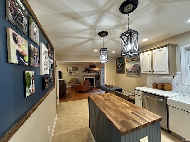 212 Alexandria Dr, Newburgh, IN 47630 - kitchen featuring butcher block counters, dishwasher, a fireplace, recessed lighting, and open floor plan