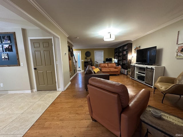 212 Alexandria Dr, Newburgh, IN 47630 - living room featuring ornamental molding, stairway, light wood finished floors, and baseboards