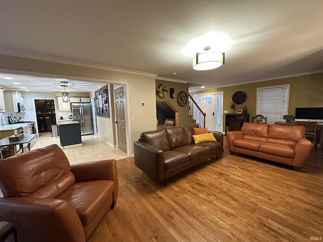 212 Alexandria Dr, Newburgh, IN 47630 - living room with crown molding, stairs, light wood-style floors, and baseboards