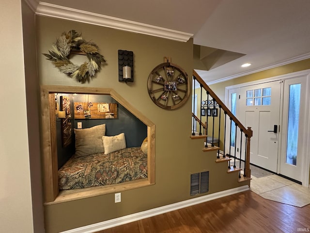212 Alexandria Dr, Newburgh, IN 47630 - foyer entrance with crown molding, wood finished floors, stairs, baseboards, and recessed lighting