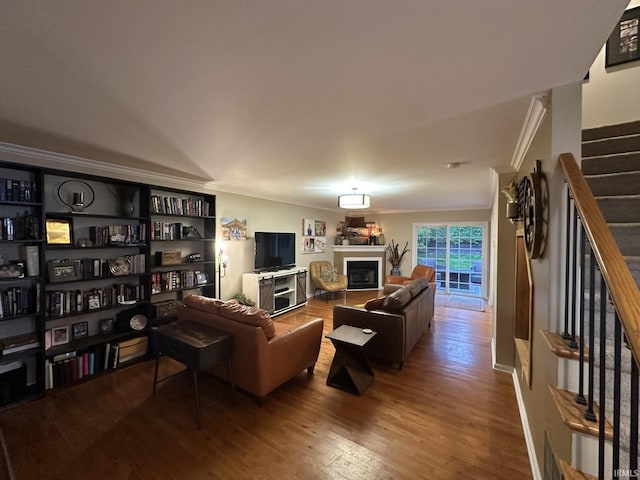 212 Alexandria Dr, Newburgh, IN 47630 - living room with ornamental molding, stairs, wood finished floors, and a glass covered fireplace