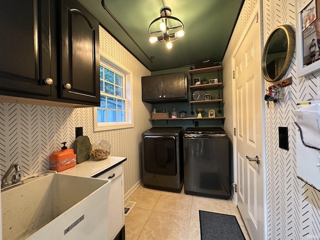 212 Alexandria Dr, Newburgh, IN 47630 - washroom featuring cabinet space, washer and dryer, and light tile patterned flooring