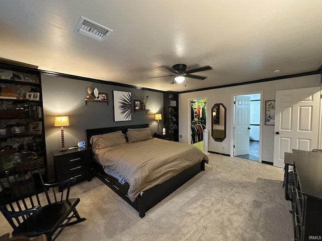 212 Alexandria Dr, Newburgh, IN 47630 - bedroom with ornamental molding, a spacious closet, a closet, ceiling fan, and light colored carpet