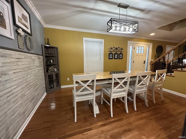 212 Alexandria Dr, Newburgh, IN 47630 - dining area featuring crown molding, stairs, wood finished floors, baseboards, and a chandelier