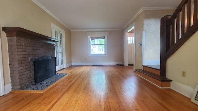 447 Englewood Ct, Fort Wayne, IN 46807 - unfurnished living room featuring wood finished floors, a brick fireplace, crown molding, and baseboards