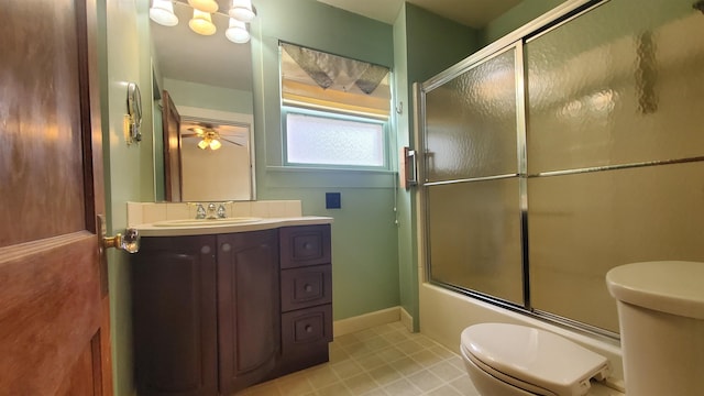 447 Englewood Ct, Fort Wayne, IN 46807 - full bath with toilet, vanity, enclosed tub / shower combo, ceiling fan, and baseboards