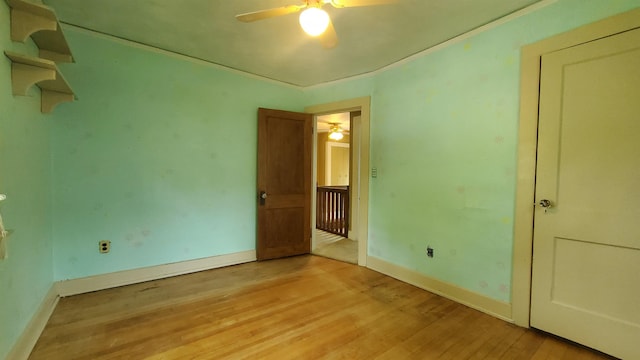 447 Englewood Ct, Fort Wayne, IN 46807 - unfurnished bedroom featuring light wood-style flooring, baseboards, and a ceiling fan