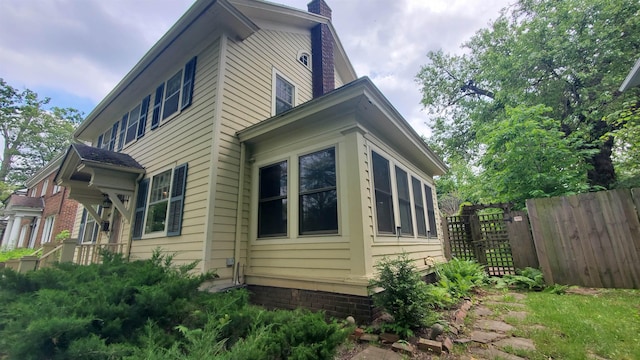 447 Englewood Ct, Fort Wayne, IN 46807 - view of side of home with a chimney