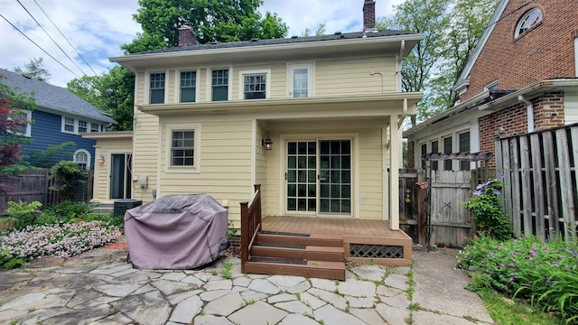 447 Englewood Ct, Fort Wayne, IN 46807 - back of house with a chimney, a wooden deck, and a patio