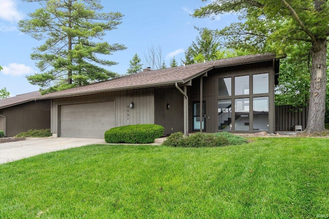 9531 Ledge Wood Ct, Fort Wayne, IN 46804 - view of front of home featuring an attached garage, a front lawn, and concrete driveway