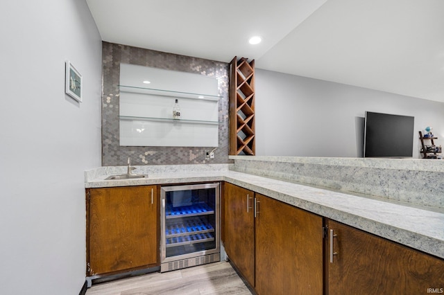 9531 Ledge Wood Ct, Fort Wayne, IN 46804 - indoor wet bar with wine cooler and light wood finished floors