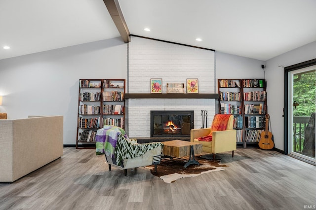 9531 Ledge Wood Ct, Fort Wayne, IN 46804 - living area featuring wood finished floors, a fireplace, and recessed lighting