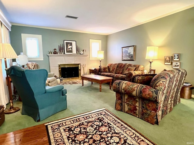 1405 19th St, Bedford, IN 47421 - living room with ornamental molding, a tiled fireplace, and carpet