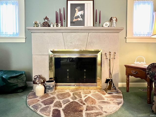 1405 19th St, Bedford, IN 47421 - detailed view of a tile fireplace, carpet floors, and baseboards