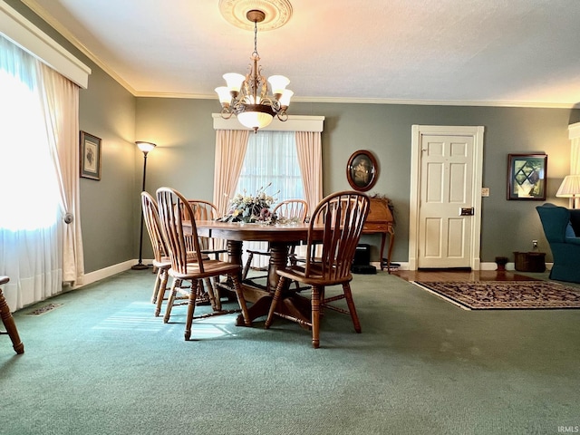 1405 19th St, Bedford, IN 47421 - dining room with a chandelier, carpet flooring, crown molding, and baseboards
