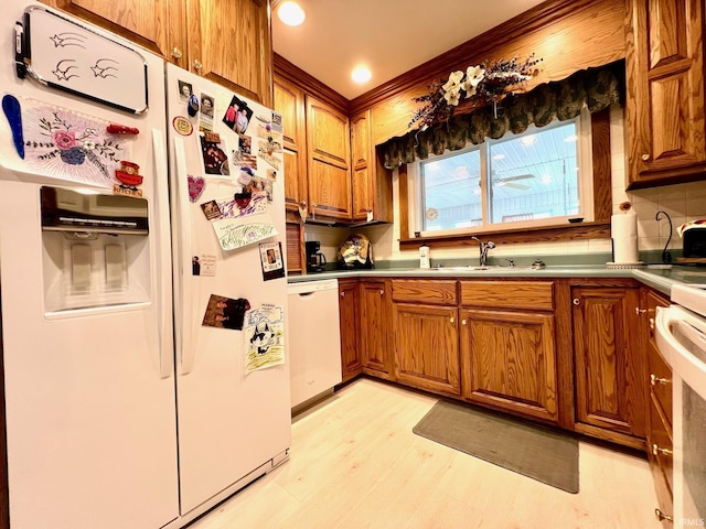 1405 19th St, Bedford, IN 47421 - kitchen featuring white appliances, brown cabinets, and light wood finished floors