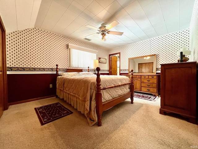 1405 19th St, Bedford, IN 47421 - bedroom with wallpapered walls, light colored carpet, baseboards, ceiling fan, and lofted ceiling