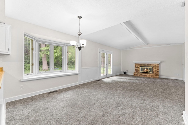 6420 Londonderry Ln, Fort Wayne, IN 46835 - unfurnished living room featuring a chandelier, carpet flooring, and a brick fireplace