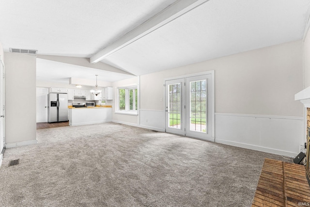 6420 Londonderry Ln, Fort Wayne, IN 46835 - unfurnished living room with a fireplace, carpet floors, and wainscoting
