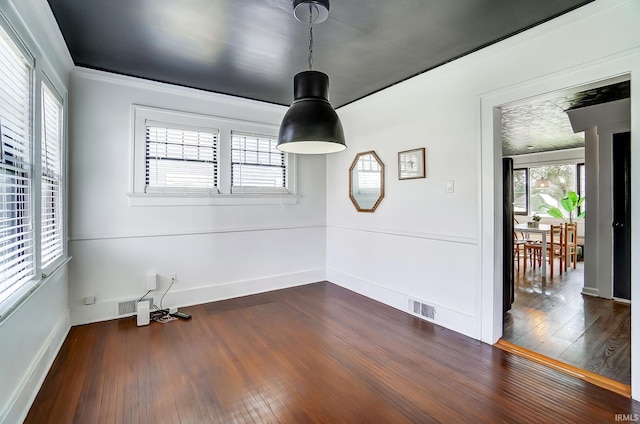 1920 Kenwood Ave, Fort Wayne, IN 46805 - spare room featuring dark wood finished floors, baseboards, and ornamental molding