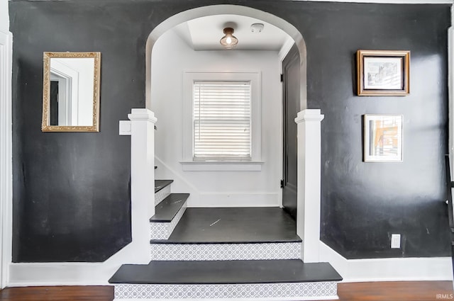 1920 Kenwood Ave, Fort Wayne, IN 46805 - stairway with arched walkways, baseboards, and wood finished floors