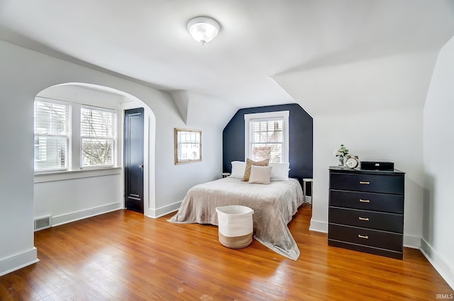 1920 Kenwood Ave, Fort Wayne, IN 46805 - bedroom featuring hardwood / wood-style floors, vaulted ceiling, and baseboards