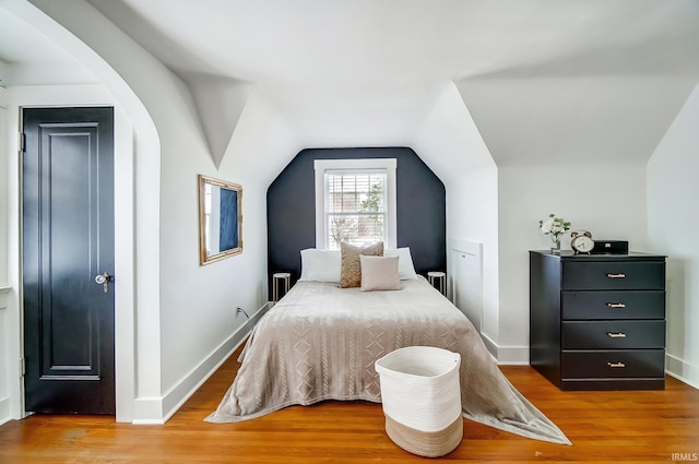 1920 Kenwood Ave, Fort Wayne, IN 46805 - bedroom with wood finished floors, vaulted ceiling, and baseboards