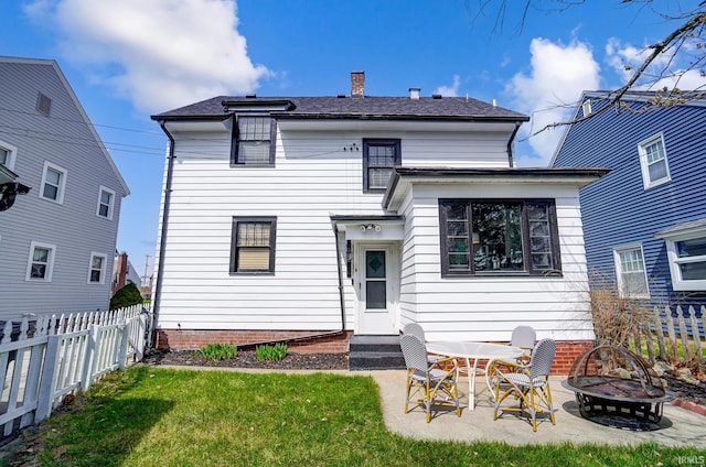 1920 Kenwood Ave, Fort Wayne, IN 46805 - rear view of house with an outdoor fire pit, a patio area, entry steps, and a chimney